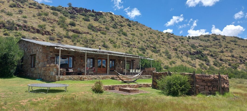 The River Lodge at Karoo Ridge Conservancy, its stone exterior looking out over the Groot-Brak River valley